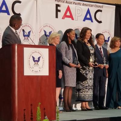 Tony Pham joins other award recipients on stage after receiving the Federal Asian Pacific American Council (FAPAC) Civilian Award for Oustanding Individual Leadership.  