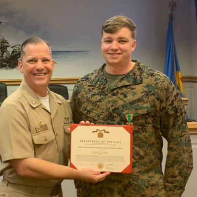 FRCE commanding officer presents certificate to depot's Marine of Year 