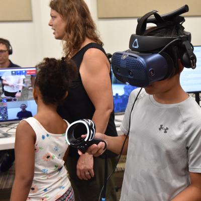 NAWCAD Lakehurst Family Day participant tests augmented reality system