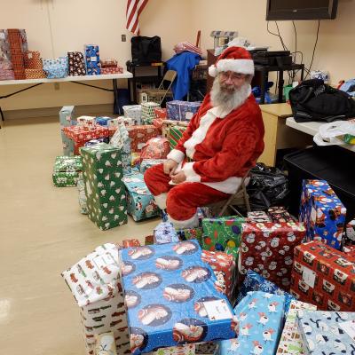 Santa with the Giving Tree gifts