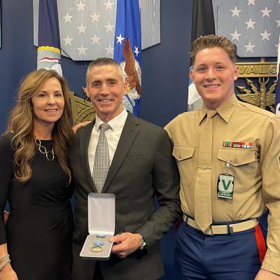 Samuel Hotz (center) pictured with his wife, Maryhelen Hotz (left), and son, Sgt. Grady Hotz (right) pictured