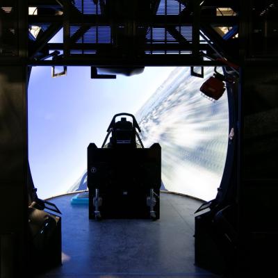 An aircraft cockpit sits in a domed simulator surrounded by nearly 360 degrees of 4K projectors.
