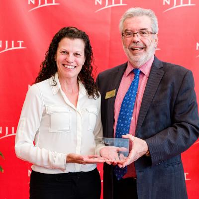 Michele Huk accepts NJIT "Best Continuous Partner Award” for NAWCAD Lakehurst