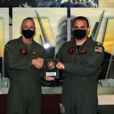 U.S. Marine Corps Col. Tom Fields, commanding officer of Air Test and Evaluation Squadron (VX) 31, left, awards U.S. Navy Lt. Scott Nieman, a native of Willis, Michigan, as VX-31’S 2020 Test Naval Flight Officer of the Year on Jan. 4 in China Lake, California. (U.S. Navy photo by Katie Archibald)