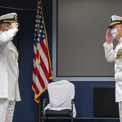 Capt. Ryan Bryla, left, relieves Capt. A.J. McFarland as commodore of Naval Test Wing Pacific during a change of command ceremony June 19 in Point Mugu, California. (U.S. Navy photo by Brian Wulfekotte)