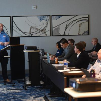 NAWCAD Lakehurst employee Kevin Larkins speaks during a meeting on shipboard robotics in Philadelphia