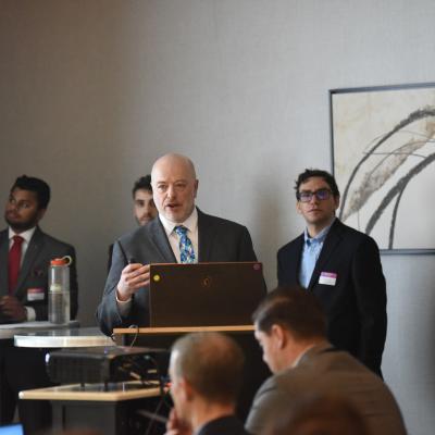 Mark Husni from Naval Air Warfare Center Aircraft Division Lakehurst speaks during a meeting on Shipboard Robotics
