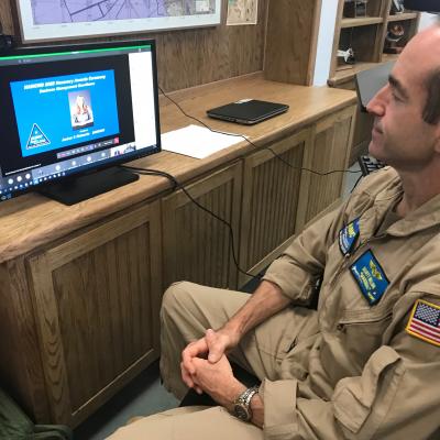 Rear Adm. Scott Dillon listens to an award citation during the NAWCWD Honorary Awards on Aug. 18. Because of COVID-19 constraints, this year’s ceremony was held virtually. (U.S. Navy photo by Renee Hatcher)
