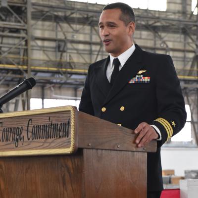 CDR Reynolds speaks at podium