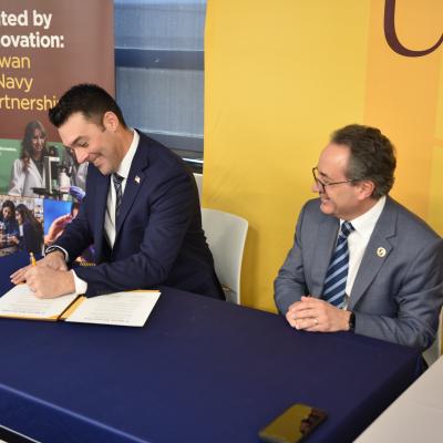 Joe Hader from NAWCAD Lakehurst signs partnership agreement with Rowan University