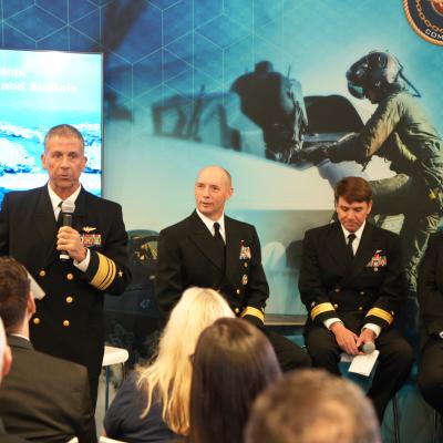 Members of Naval Air Systems Command leadership present the “Advancing the Way We Develop, Integrate, Test, Train, Field and Sustain Naval Aviation Capability" panel at the Sea-Air-Space Expo 2024. From left, NAVAIR Commander Vice Admiral Carl Chebi; Rear Admiral Joe Hornbuckle, Commander, Fleet Readiness Centers; Rear Admiral John Dougherty, Commander, Naval Air Warfare Center Aircraft Division (NAWCAD); and Dan Carreño, executive director of Naval Air Warfare Center Weapons Division (NAWCWD).