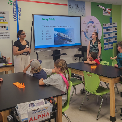 Team members from NAWCAD Lakehurst present to the STARBASE program campers