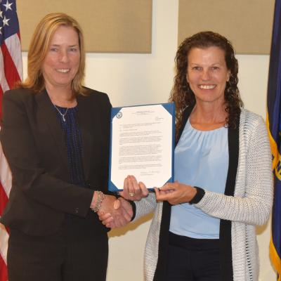 NAWCAD Lakehurst Executive Director Kathleen P. Donnelly presents the Supervisor of the Year Award to Michele Huk