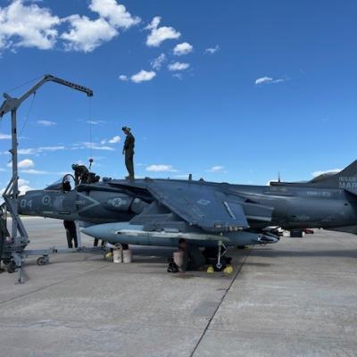 Marine Corps demilitarization team work on an AV-8B+ Harrier 