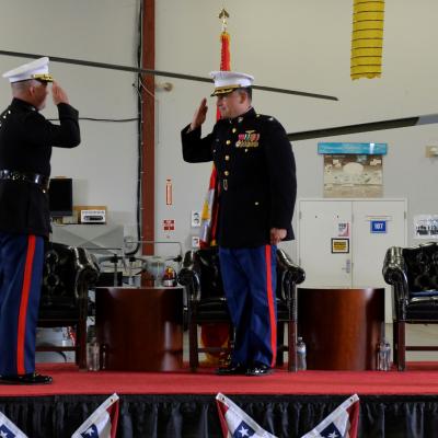 Lt. Col. Gary Shill salutes Naval Test Wing Atlantic Commodore, Col. Richard Marigliano