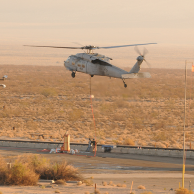 VX-31 helicopter lifts parachute