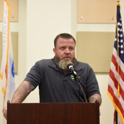Dennis Addesso, President of veterans organization Ma Deuce Deuce, speaks at a Veterans luncheon held at NAWCAD Lakehurst
