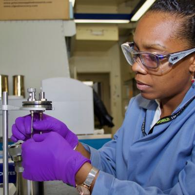 Dr. Josanne Woodroffe, a research chemist at Naval Air Warfare Center Weapons Division, measures the heat of combustion of a fuel sample on Feb. 28 at China Lake.
