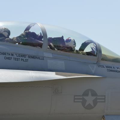 Capt. Elizabeth Somerville flies with Lt. Col. Mark Amspacher during an airborne change of command ceremony