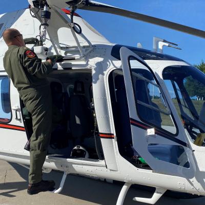 Instructor pilot conducts pre-flight check on TH-73A