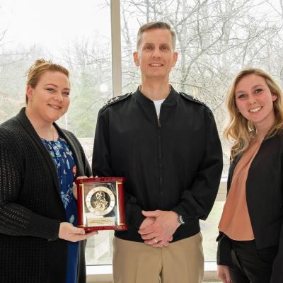 Simplified Acquisition Procedures Procurement Team members Tracy Lind (left) and Markelle Griffin stand with the Small Business Advocacy Award presented by Vice Adm. Dean Peters, NAVAIR commander, during the NAVAIR Commander’s Awards ceremony on March 10 at Naval Air Station Patuxent River. (U.S. Navy photo by Peter Fitzpatrick)