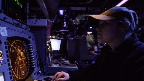 Sailor identifies air contacts from the combat information center 