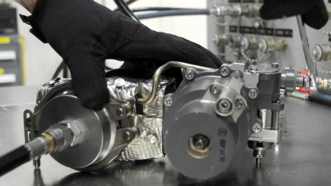 Man readies F-35 valve for testing
