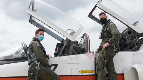 NASA research pilot and U.S. Naval Test Pilot School (USNTPS) instructor Cmdr. Adam Klein, right, prepares for a T-38C training flight with USNTPS student Lt. Spencer Smith. Klein and fellow instructor Dick Clark oversaw the training of USNTPS students in NASA's T-38N simulator in Houston, Texas, after the COVID-19 pandemic prevented students from being able to conduct their pre-arrival training at Randolph Air Force Base. (U.S. Navy photo by Paul Lagasse)