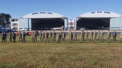 A group of aerospace engineering midshipmen from the United States Naval Academy toured Naval Test Wing Atlantic Nov. 9, 2020, an annual event sponsored by Prof. Robert Niewoehner (third from right), a former F-14 Tomcat test pilot and a graduate of the U.S. Naval Test Pilot School.