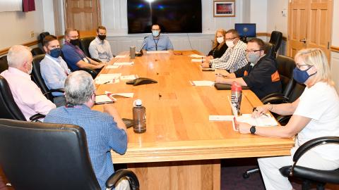 Group of FRCE leaders around table