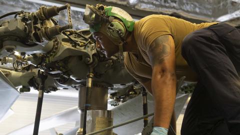 Maintainer on a MH-60S Seahawk