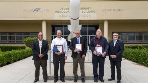 NAWCWD Fellow inductees from Point Mugu pose for a picture with Dan Carreño, NAWCWD executive director, left, and Tom Dowd, NAWCWD’s Ranges, Target Operations, Instrumentation and Labs Group director, right, after the Fellows induction ceremony on July 13. (U.S. Navy photo by Rob Grabendike)