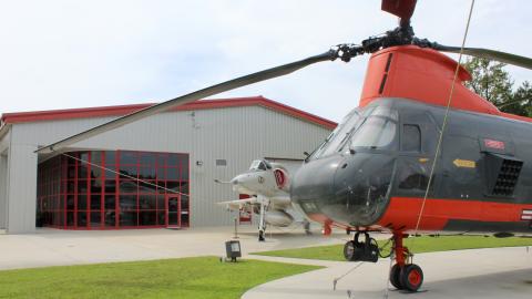 HH-46 helicopter in front of tourist center