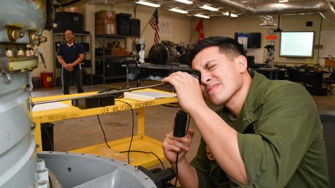 U.S. Marine Corps Lance Cpl. Jesus Hernandez, assigned to Marine Attack Squadron (VMA) 223, participates in a practical exercise as part of the F402 Engine Tier 5 Tier 5 Remote Visual Inspection (RVI) Inspector Rating certification course at Fleet Readiness Center East, Mar. 6, 2023.