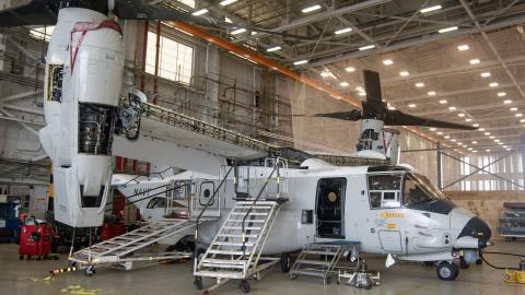 Navy CMV-22B aircraft in maintenance hangar
