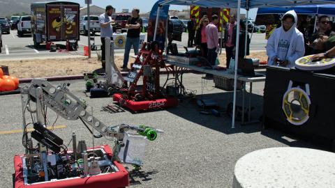 A FIRST Robotics participant pilots his team’s robot creation during the 2019 Point Mugu Command Thank You event. (U.S. Navy photo by Kimberly Brown)