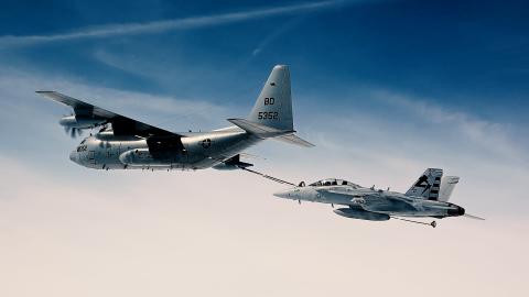 A KC-130T refuels an EA-18G Growler in the skies over Naval Air Station Patuxent River, Maryland.