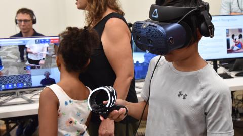 NAWCAD Lakehurst Family Day participant tests augmented reality system