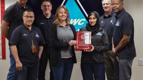 The Mission Safety Team stands with the Joint Base McGuire-Dix-Lakehurst Squadron Excellence in Safety Large Industrial Award