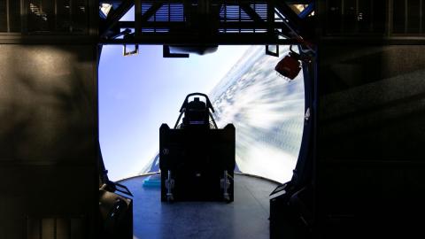 An aircraft cockpit sits in a domed simulator surrounded by nearly 360 degrees of 4K projectors.