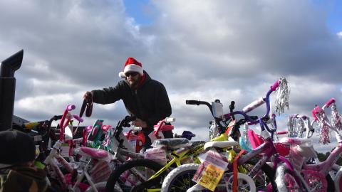 Volunteer delivers bikes for toys for tots