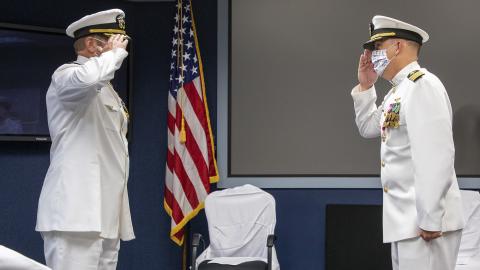 Capt. Ryan Bryla, left, relieves Capt. A.J. McFarland as commodore of Naval Test Wing Pacific during a change of command ceremony June 19 in Point Mugu, California. (U.S. Navy photo by Brian Wulfekotte)