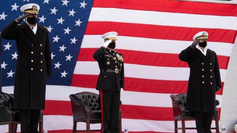 Capt. Adam Scott, Maj. Gen. Greg Masiello and Capt. William Coleman, Jr salute during the PMA-271 Change of Command.