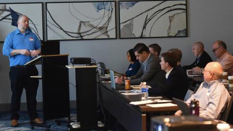 NAWCAD Lakehurst employee Kevin Larkins speaks during a meeting on shipboard robotics in Philadelphia