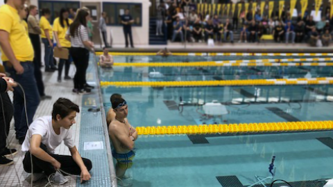 Students operate underwater robots in the Rowan University pool