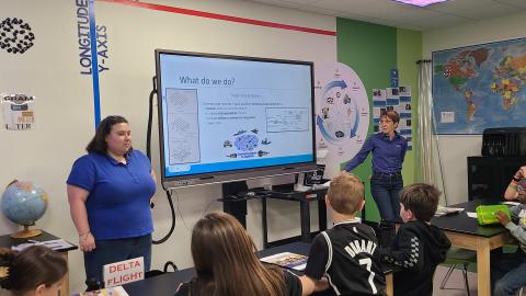 STARBASE volunteers with students