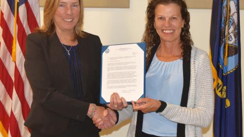 NAWCAD Lakehurst Executive Director Kathleen P. Donnelly presents the Supervisor of the Year Award to Michele Huk