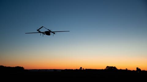 An autonomous vehicle - dubbed Blue Water Maritime Logistics UAS - flies over Unmanned Air Test and Evaluation (UX) 24 during a demonstration flight at NAS Patuxent River.