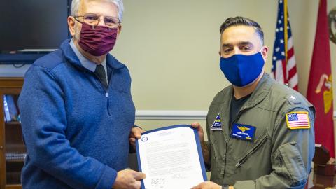 Rear Adm. John S. Lemmon, right, presents Tony Spadarella with the 2021 NAWCAD Patuxent River Mentor of the Year Award during a ceremony at the VX-20 hangar on Feb. 8.